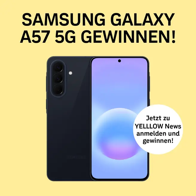 Fr&ouml;hlicher Mann mit gelbem Smartphone in der Hand